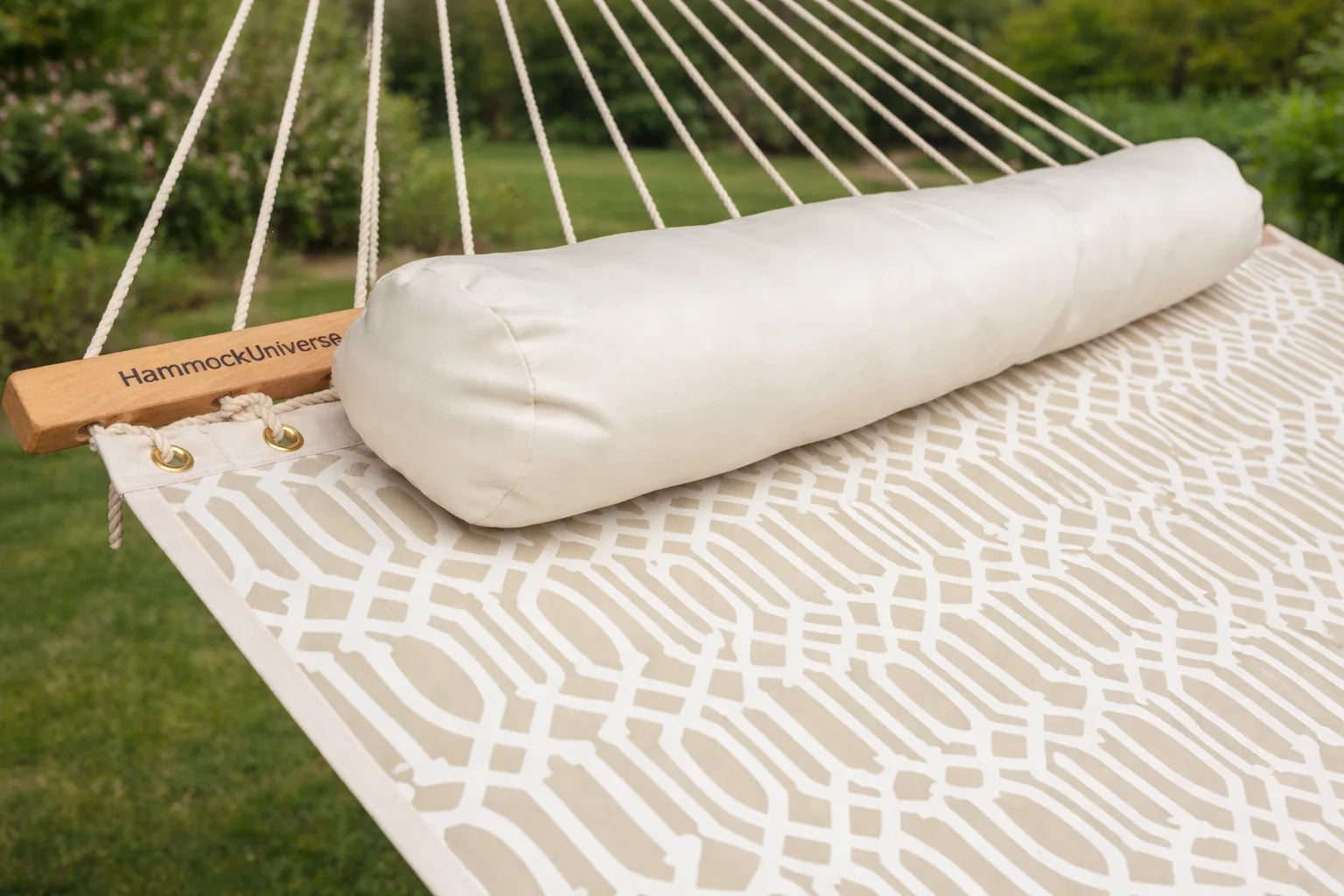 Roll of hammock fabric on a hammock with 'Hammock Universe' branding. QHD-COUNTRY