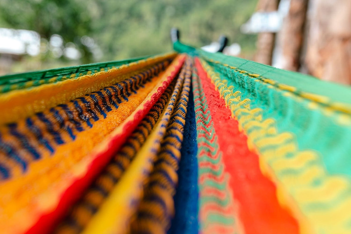Close-up of colorful fabric with a blurred natural background
