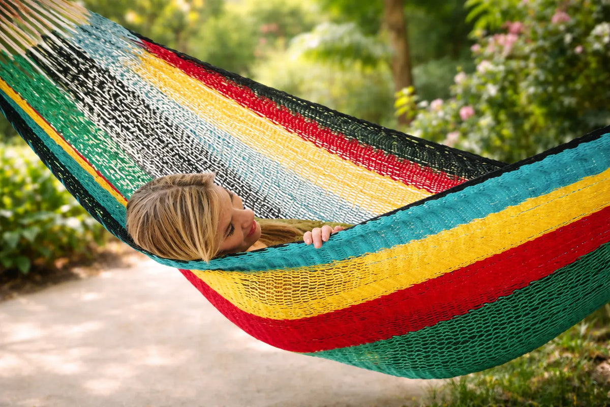 Colorful hammock with a person relaxing in a garden setting #24-MHXLTC-H