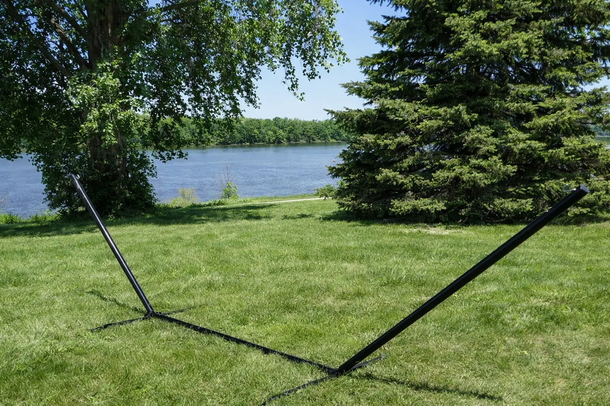 Hanging hammock stand on grass with trees and lake in the background QHD-BWP+15TBSB,QHD-GBGW+15TBSB,QHD-COUNTRY+15TBSB,QHD-CAROLINA+15TBSB
