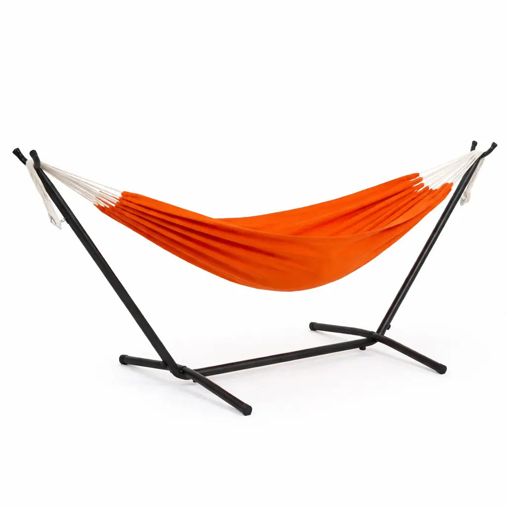 Orange hammock on a black stand against a white background